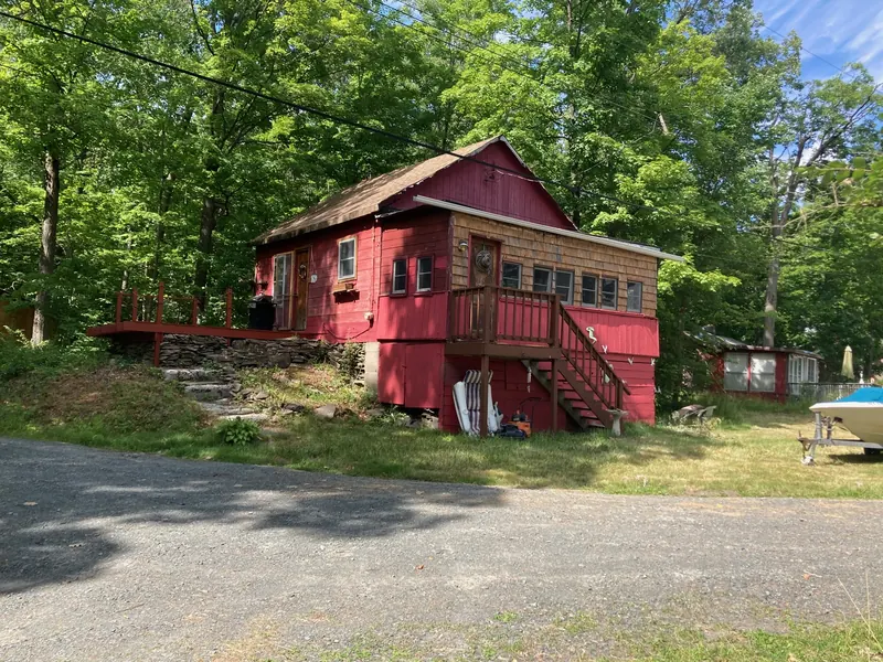 Cabin 15, a red cabin in the woods