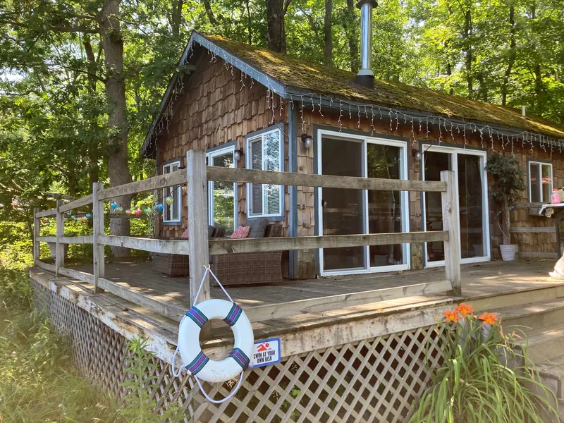 Cabin 5, a cedar-shingle cabin with glass doors