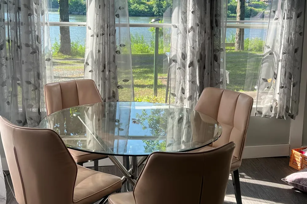 Dining table with river views at Cabin 14